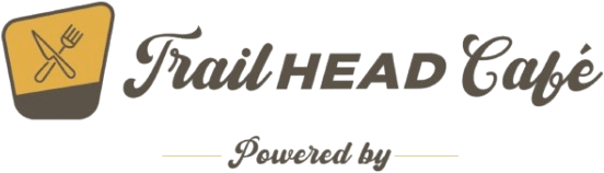 TrailHEAD Café branding logo with a yellow fork-and-knife icon, script title, and 'Powered by AKIS BreadHaus' text.